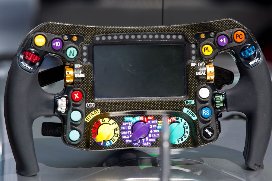 The carbon-fiber 2017 Mercedes F1 car steering wheel on a display stand