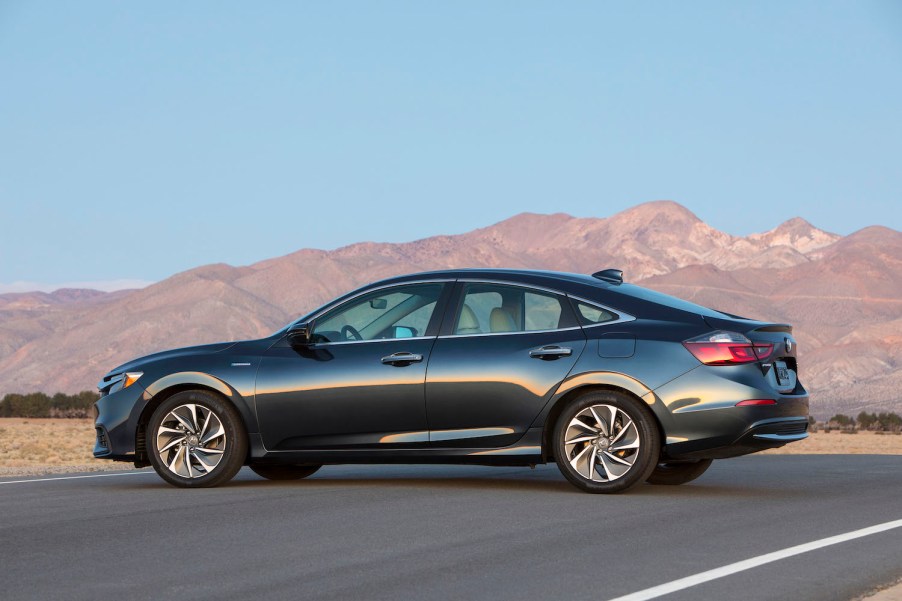 A black 2022 Honda Insight parked in front of a mountain range, the Insight is one of the best new cars under $40,000