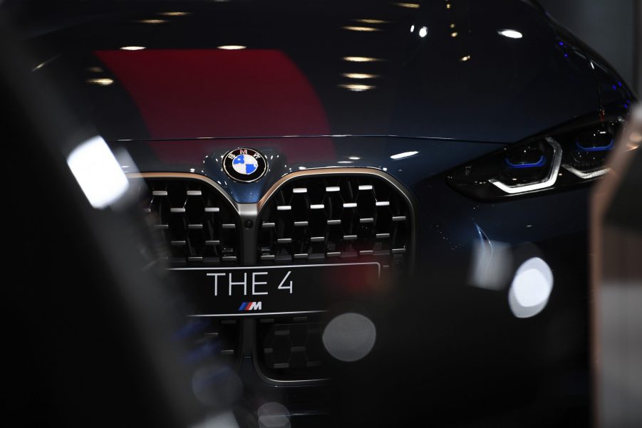 A black BMW 4 Series luxury automobile in the BMW Welt showroom, operated by Bayerische Motoren Werke AG, in Munich, Germany