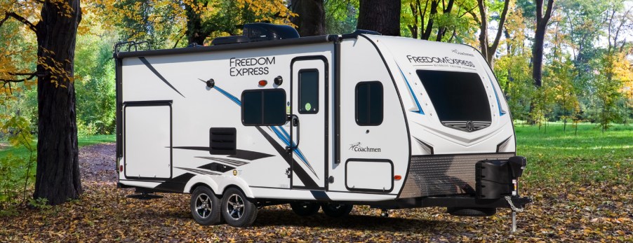 Coachmen RV trailer in a press photo in the forest