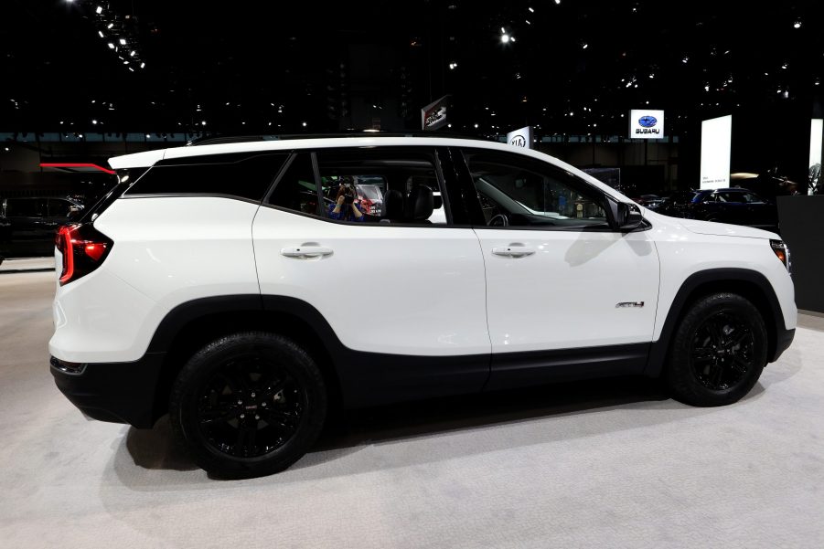 A white GMC Terrain in the booth at an auto show