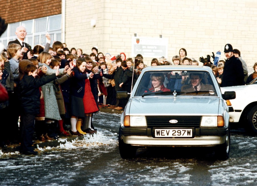 An image of Princess Diana driving her Ford Escort.