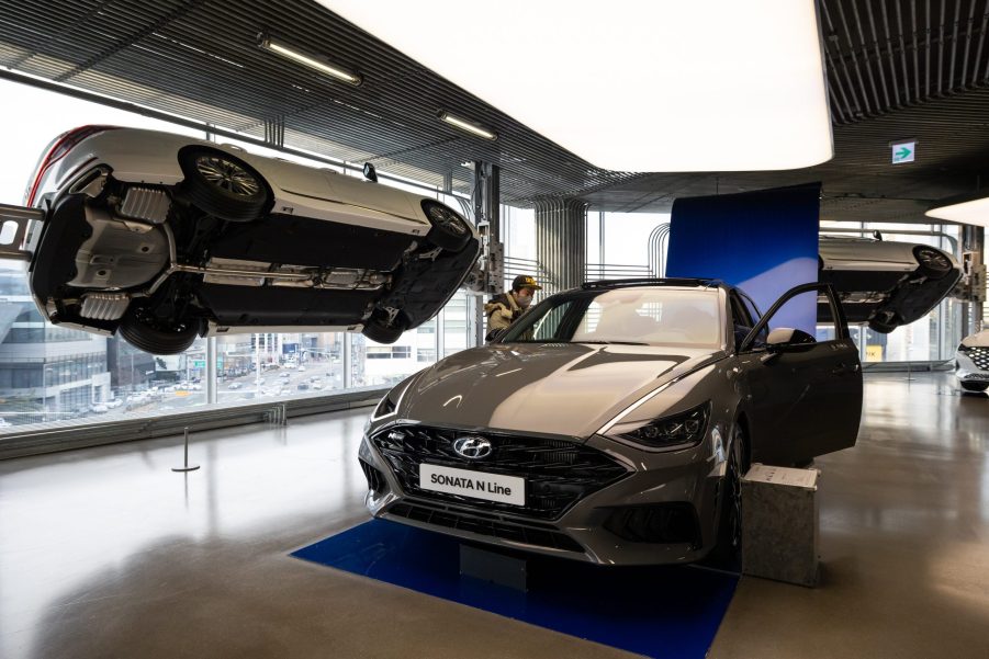 A customer looks at a gray Hyundai Motor Co. Sonata N Line sedan at the company's Motorstudio showroom in Seoul, South Korea