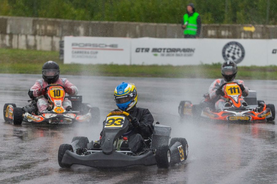 Several kart racers driving around the wet track at the 2020 Prince Carl Philip Racing Trophy at GTR Motorpark in Eskilstuna, Sweden