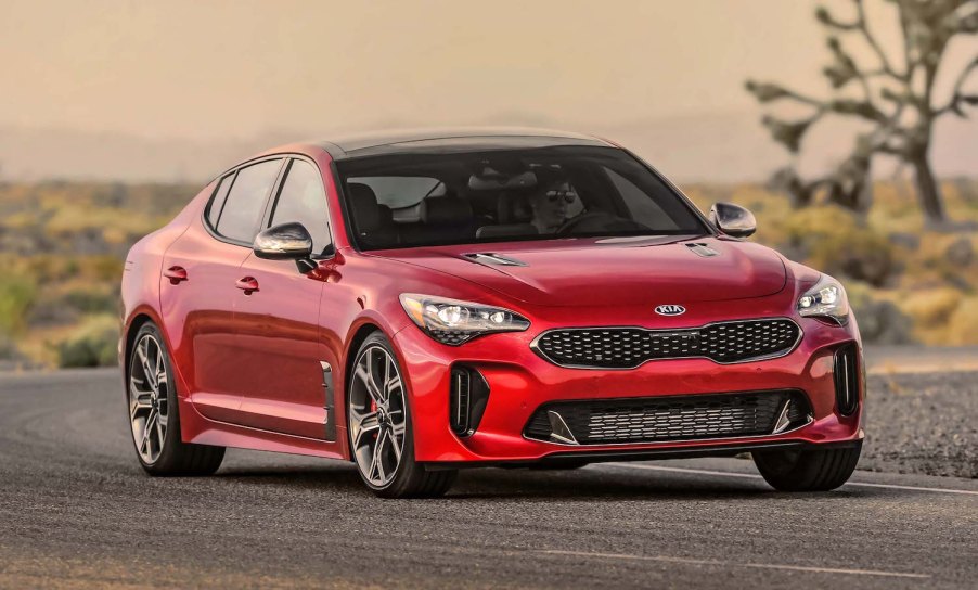 A red 2021 Kia Stinger driving