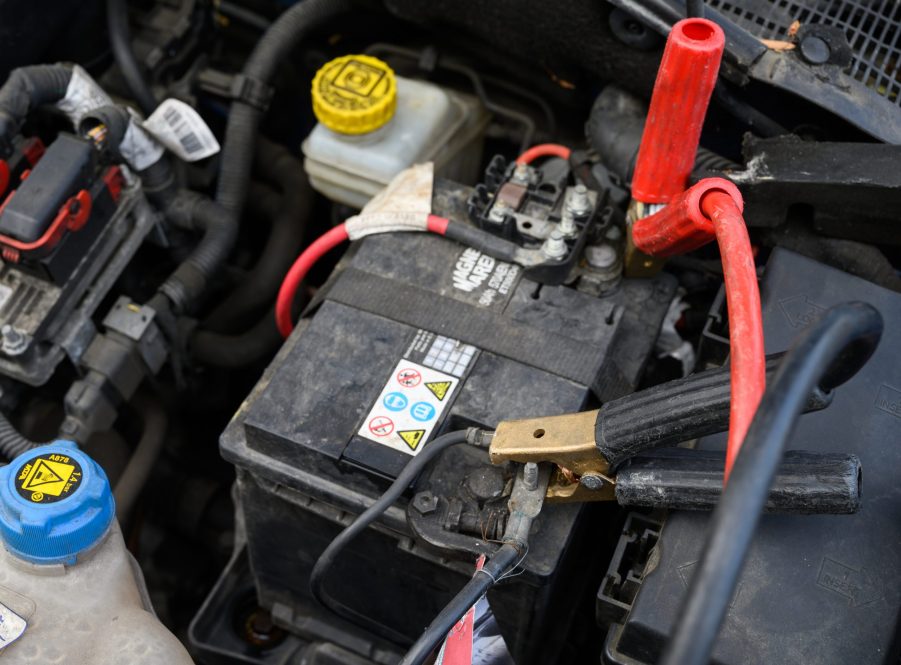 12 Volt Car Battery Hooked To Jumper Cables