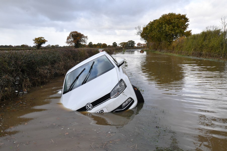 A flooded car in a river in England