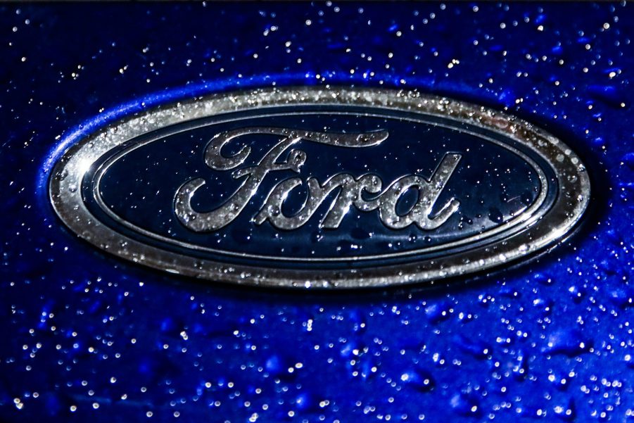 The Ford logo on one of their vehicles in the rain