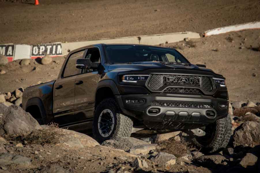 A black 2021 Ram 1500 TRX climbing over rocks