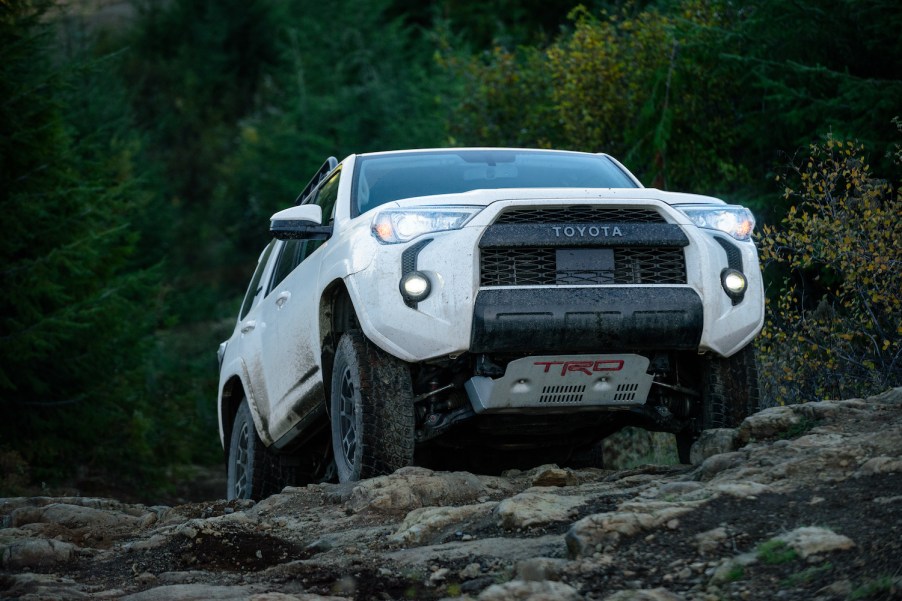 A white 2021 Toyota 4Runner TRD Pro climbing rocks