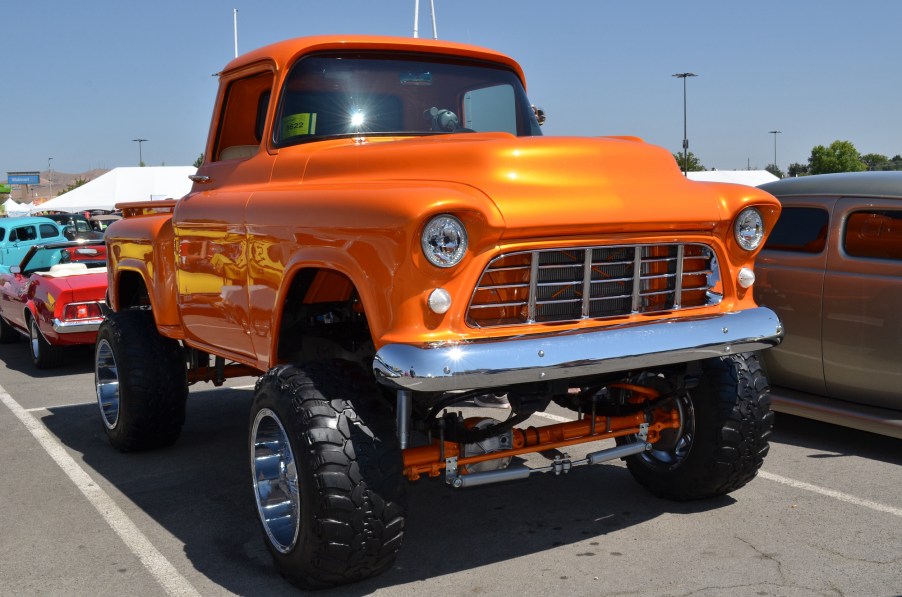 A 1955 Chevy pickup with a raised suspension and huge off-road tires in August 2017 in Reno, Nevada