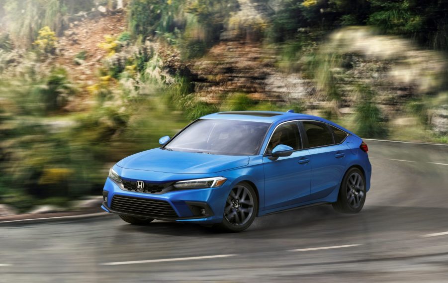 The 2022 Honda Civic hatch, seen in blue on a country back road