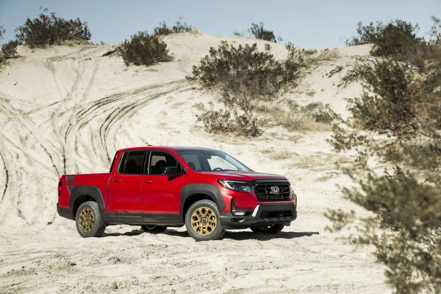 Red Honda Ridgeline parked in the desert. This is the same model and color as we had in our 2021 Honda Ridgeline review