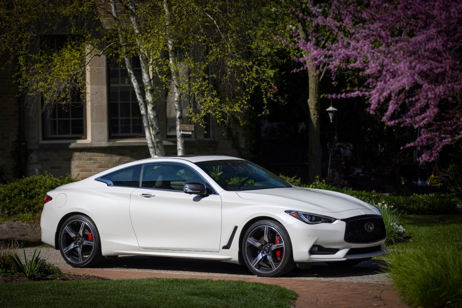 The 2022 Infiniti Q60 parked near a home