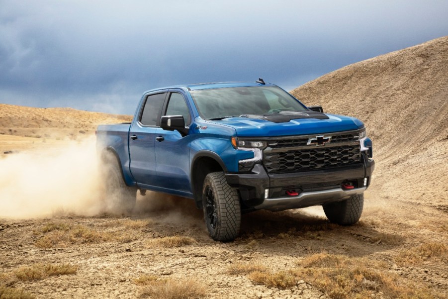 Blue 2022 Chevrolet Silverado ZR2 driving on desert terrain