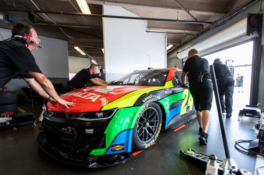 DAYTONA BEACH, FLORIDA - SEPTEMBER 07: Team members push the #24 NASCAR Next Gen car, driven by William Byron, out of the garage during the NASCAR Cup Series test at Daytona International Speedway on September 07, 2021 in Daytona Beach, Florida. he NASCAR next gen transmission is a P1334 five-speed manual-sequential transaxle transmission built by Xtrac. (Photo by James Gilbert/Getty Images)