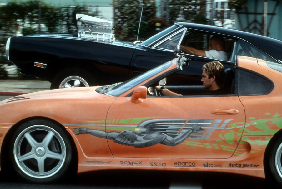 Vin Diesel and Paul Walker in 'The Fast And The Furious', 2001. This straightforward drag race is far from the less believable, physics defying Fast and Furious stunts of later films. | Universal/Getty Images