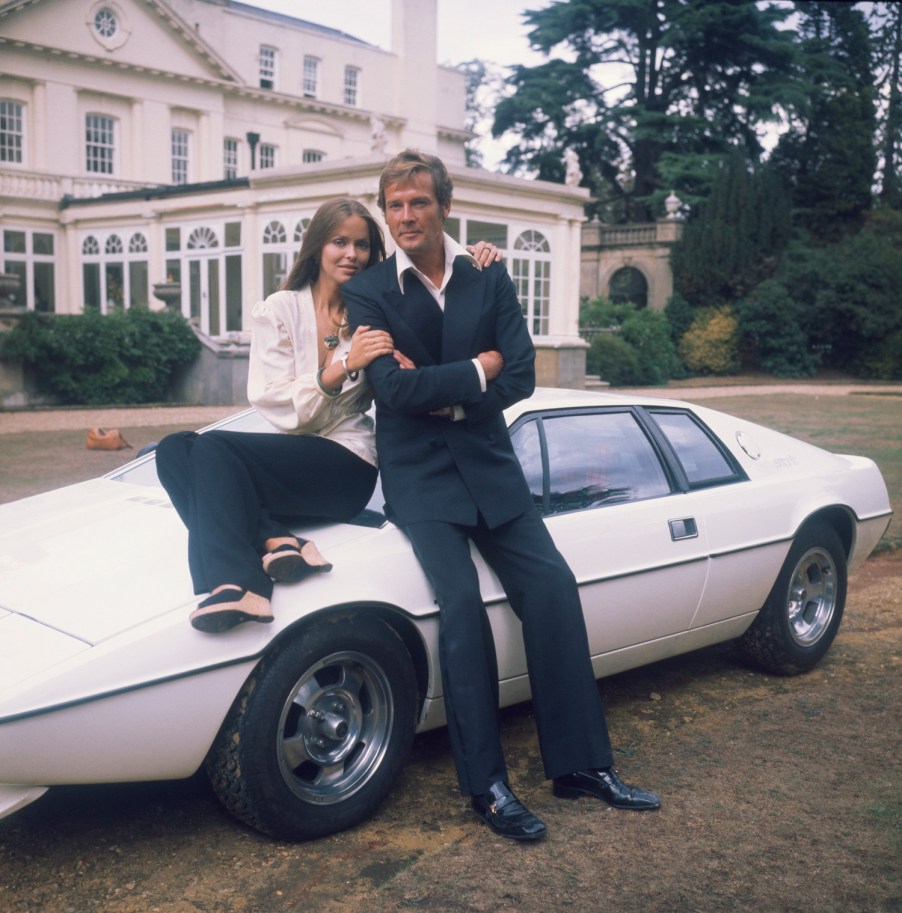 1977: Barbara Bach and Roger Moore, stars of the James Bond film 'The Spy Who Loved Me' leaning on the now-famous 'amphibious' Lotus Esprit. (Photo by Hulton Archive/Getty Images). Jay Leno also loves this classic sports car.