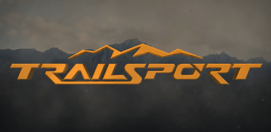 Orange Honda Trailsport logo with mountains in the background