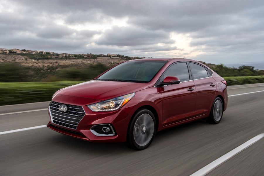 A red 2022 Hyundai Accent on the road on an overcast day