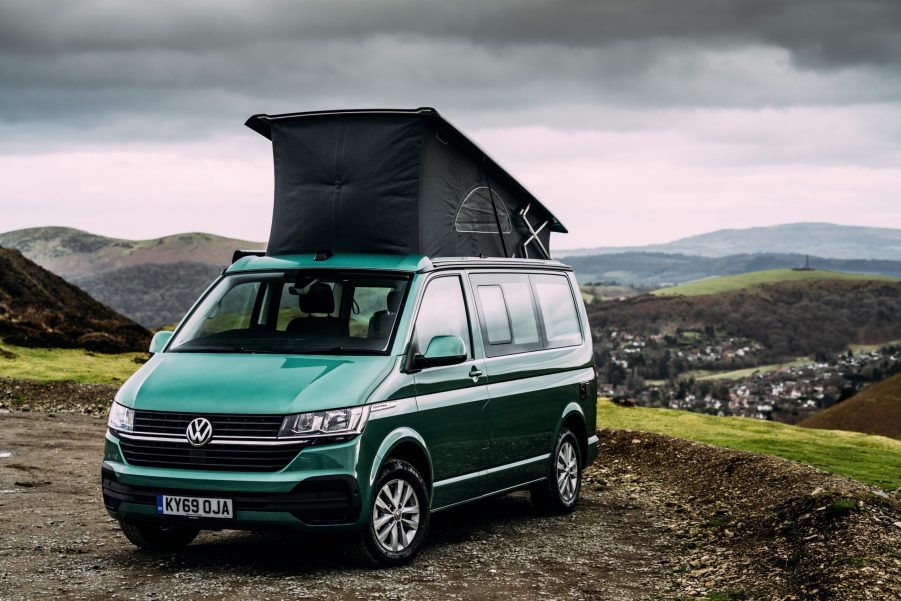 VW camper van with its top popped up