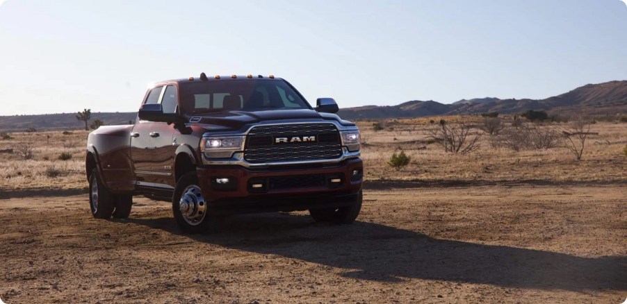 A maroon 2021 Ram 1500 in a desert.