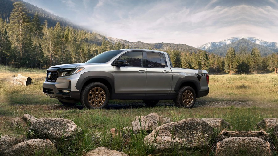 A silver 2022 honda ridgeline equipped with the HPD package parked outside