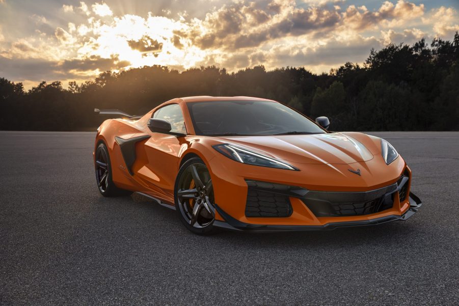 An orange 2023 Chevrolet Corvette Z06 shot from the front 3/4 at sunset