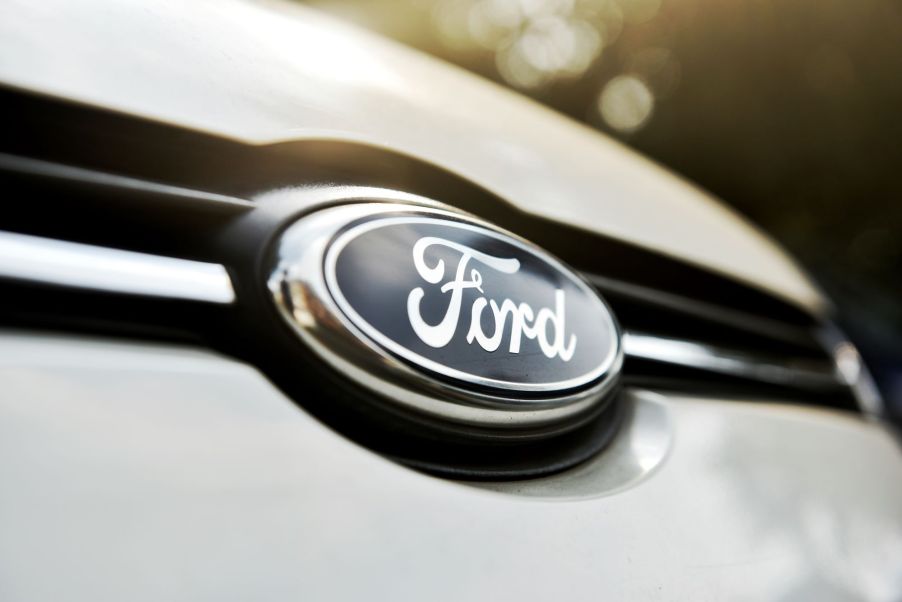 A Ford logo, where David Fields now works, on the front of a white vehicle.