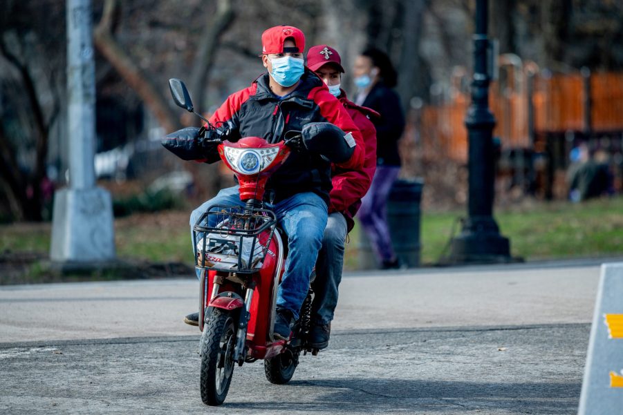 Men Riding On Moped