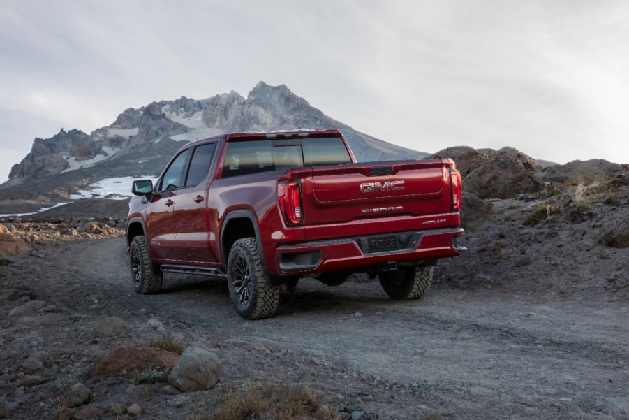 Red 2022 GMC Sierra 1500 AT4X driving on a mountainous road