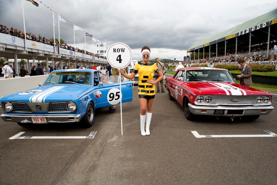 1965 Plymouth Barracuda (left) alongside a Ford Galaxie at Goodwood