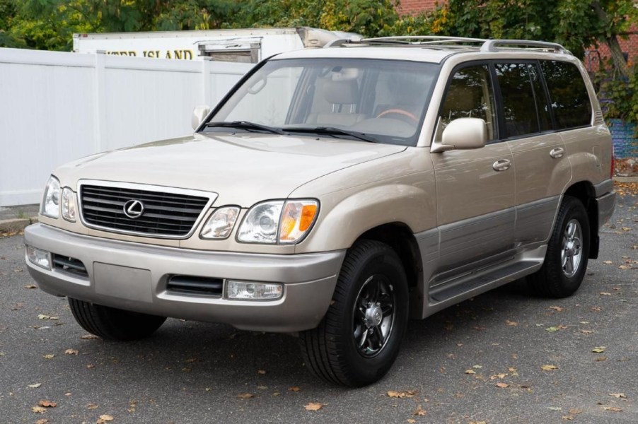 A tan-and-gray 2002 Lexus LX 470 in a parking lot