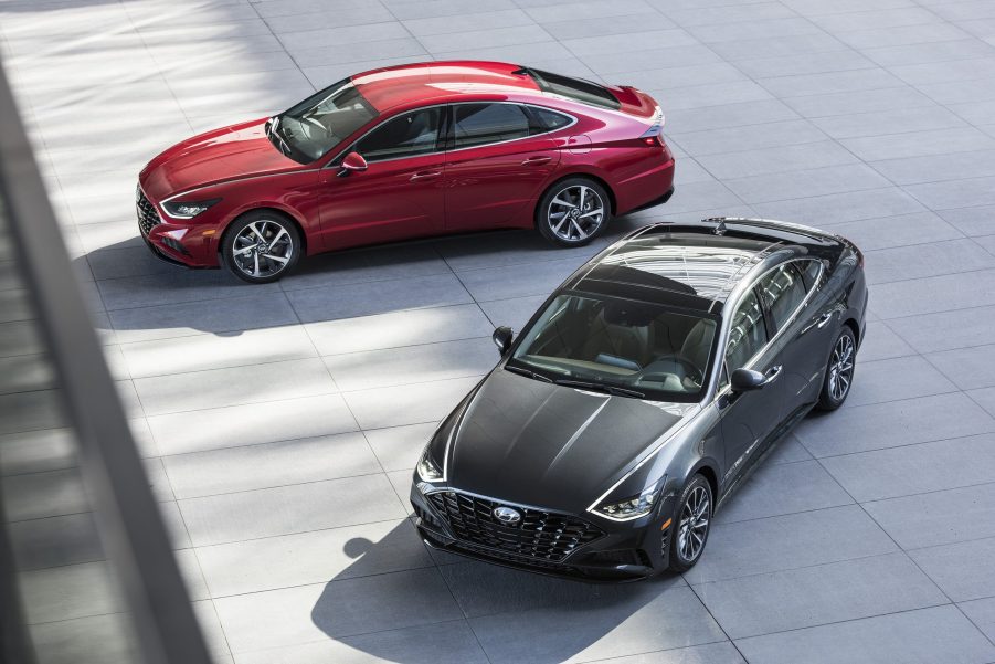 A pair of 2022 Hyundai Sonata mid-size sedan models in red and black