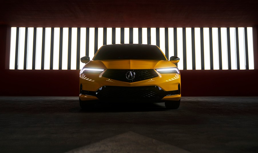 2023 Acura Integra Prototype painted in Indy Yellow Pearl photographed inside a parking garage. This prototype will be the base for the 2023 Acura Integra