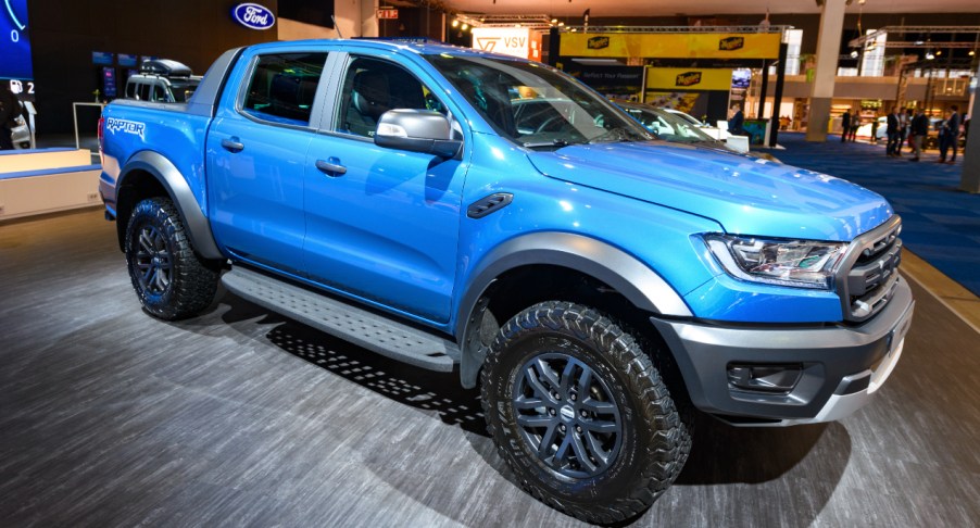 A blue Ford Ranger is on display.