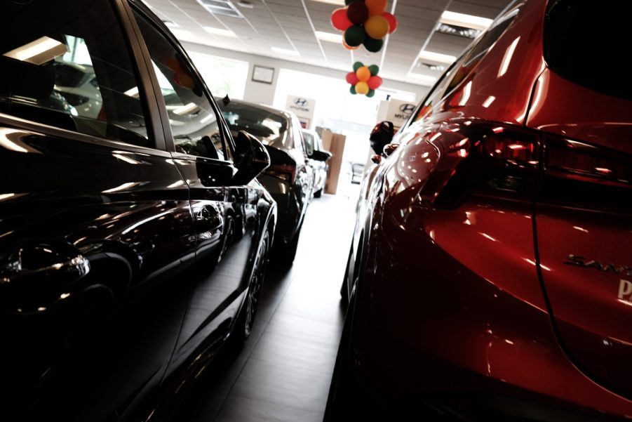 New cars sitting in dealership showroom