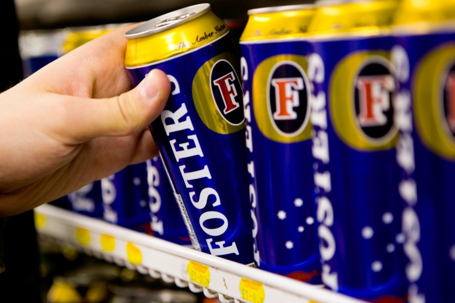 A man was seen drinking beer on the hood of a Ford Ute