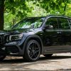 A black 2021 Mercedes-AMG GLB 35 in a forest parking lot