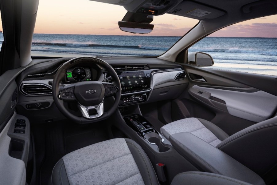 A 2022 Chevy Bolt EUV's cockpit overlooking a large body of water