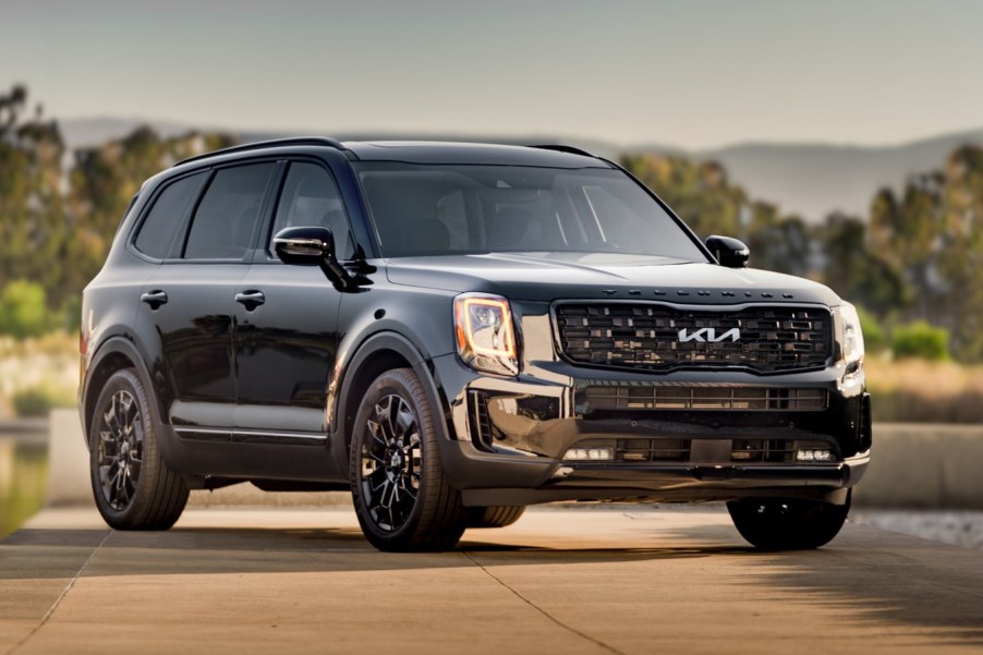 A black 2022 Kia Telluride parked outside.