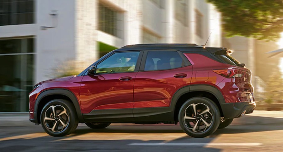 A red 2022 Chevy Trailblazer is driving on the road.