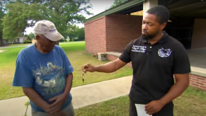 Elliot Middleton, an South Carolina auto mechanic, giving car keys for a car donation to a man in need