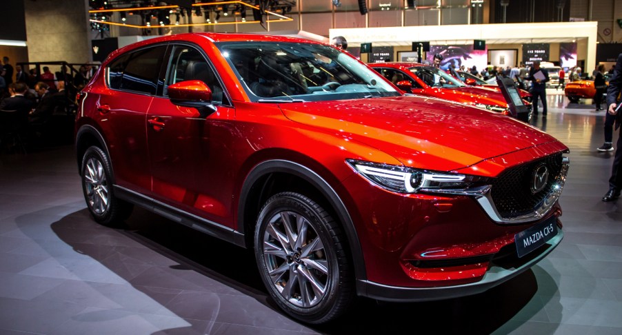 A red 2021 Mazda CX-5 compact SUV model is on display.