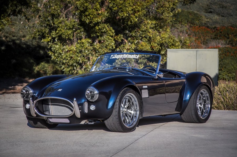 The dark-blue Superformance MKIII-E electric Shelby Cobra replica