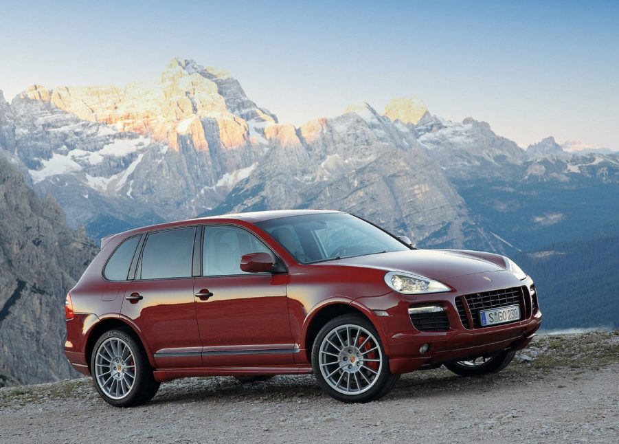 A red 2008 Porsche Cayenne GTS in the mountains