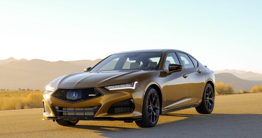 A yellow pearl 2022 Acura TLX Type S luxury sedan shot from the front 3/4