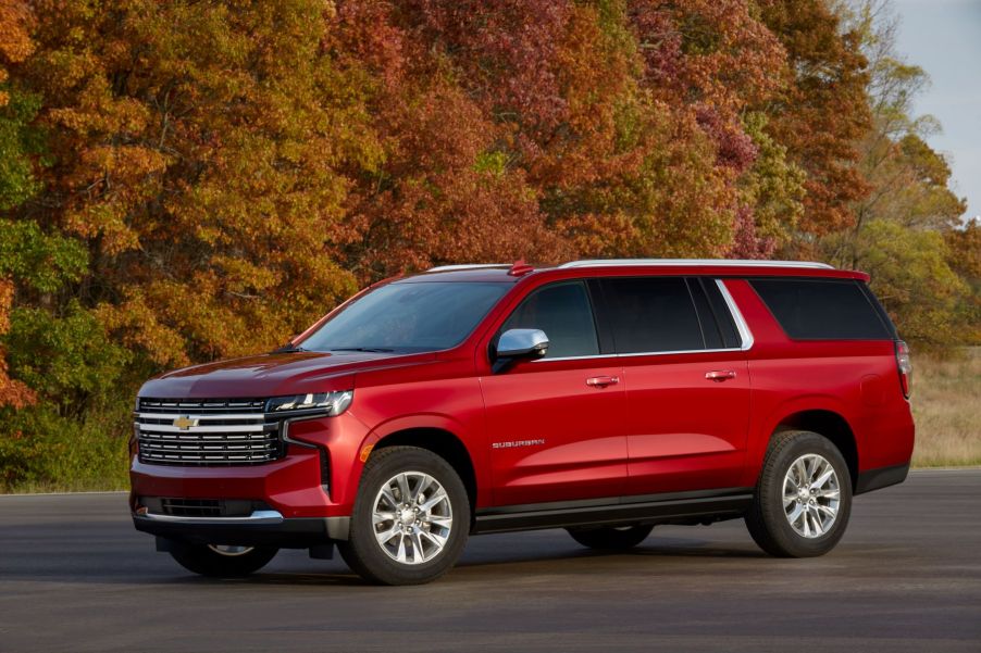 A 2022 Chevrolet Suburban in red paint color option and a Duramax Turbo-Diesel powertrain is one of the SUVS with the best towing capacity on the market.