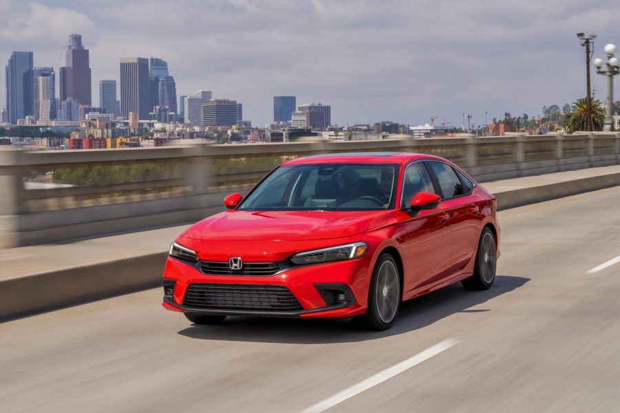 A red 2022 Honda Civic sedan shot from the front 3/4