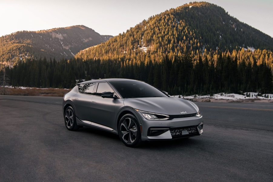 A 2022 Kia EV6 in a wooded mountainous environment on blacktop.